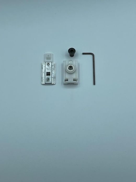 Pièce de rétention pour guide